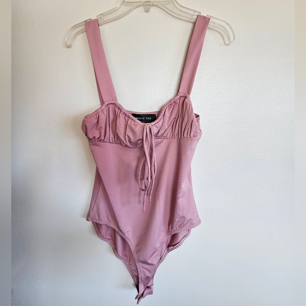 White fox pink body suit